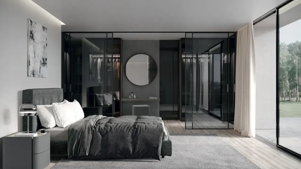Elegante camera da letto con letto grigio scuro, abbinamenti moderni e cabina armadio a vista.