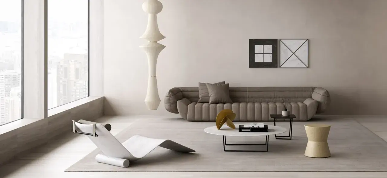 Un angolo relax salotto con chaise longue di design, divano imbottito, tavolino con libro Vogue e un'imponente lampada a sospensione.