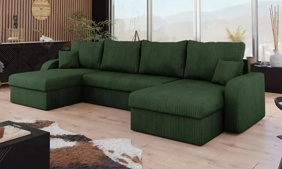 Divano angolare in velluto a coste verde foresta, con cuscini morbidi e un design moderno che invita al relax.