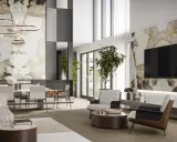 Un elegante salotto e sala da pranzo insieme, con pareti in pietra naturale e illuminazione moderna.