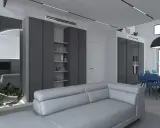 Elegante salotto grigio e bianco con divano moderno, zona pranzo con sedie colorate e un'originale parete a specchio con illuminazione.