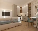 Soggiorno beige e bianco con divano, cucina moderna, tavolo rotondo e quadro astratto.