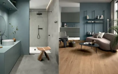Bagno moderno con lavabo e doccia, soggiorno con divano curvo e libreria. Colori che si abbinano con il grigio, creando un'atmosfera rilassante.
