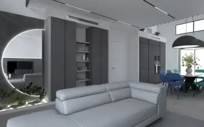 Elegante salotto grigio e bianco con divano moderno, zona pranzo con sedie colorate e un'originale parete a specchio con illuminazione.