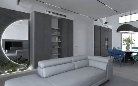 Elegante salotto grigio e bianco con divano moderno, zona pranzo con sedie colorate e un'originale parete a specchio con illuminazione.