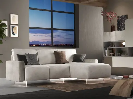 Divano angolare moderno con chaise longue, cuscini decorativi e vista panoramica sulla città al tramonto. Ideale per chi cerca un modo per modificare il proprio salotto.