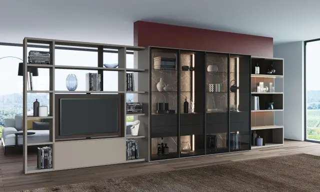 Elegante porta tv girevole design, con libreria componibile e vetrine illuminate, perfetta per un salotto moderno.