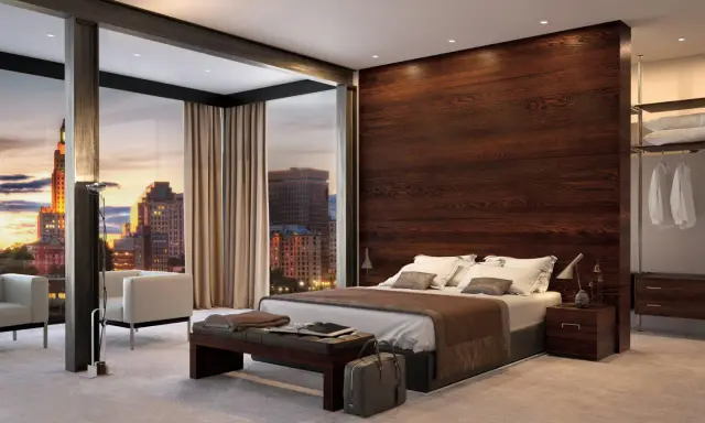 Moderna camera da letto con parete dietro letto idee in legno scuro, vista panoramica sulla città al tramonto.