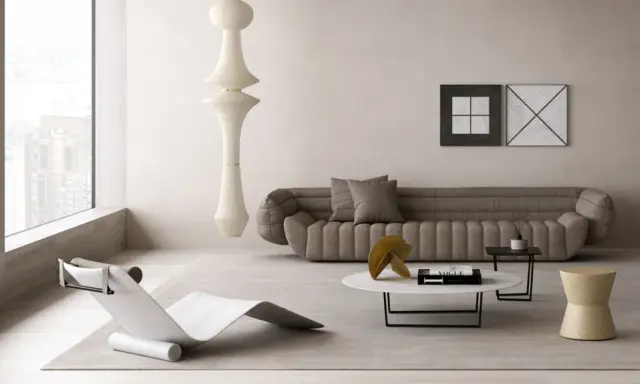 Un angolo relax salotto con chaise longue di design, divano imbottito, tavolino con libro Vogue e un'imponente lampada a sospensione.