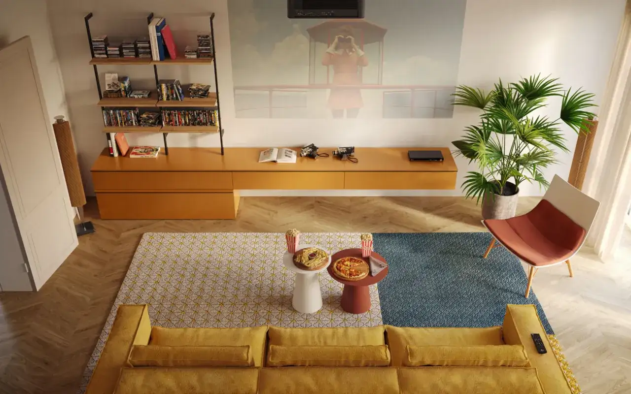 Come arredare una sala: divano giallo, tappeti geometrici, tavolini con pizza e popcorn, poltrona moderna, libreria e proiettore per serate cinema.